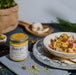 A jar of creamy Carbonara sauce infused with rich flavors for a delicious pasta dish.