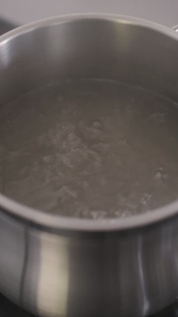 Delicious Carbonara sauce in a jar with rich, creamy texture for pasta.